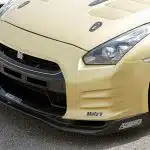 Top Secret V1 Front Bumper Kit GT-R CBA / DBA, Installed on Gold GT-R - Close Upper Front Side View of Car