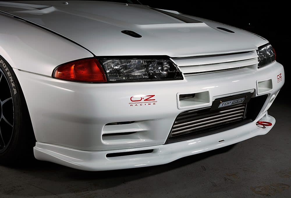 Top Secret R32 GT-R Front Lip, Installed on White GT-R - Front Side View of Lip Spoiler