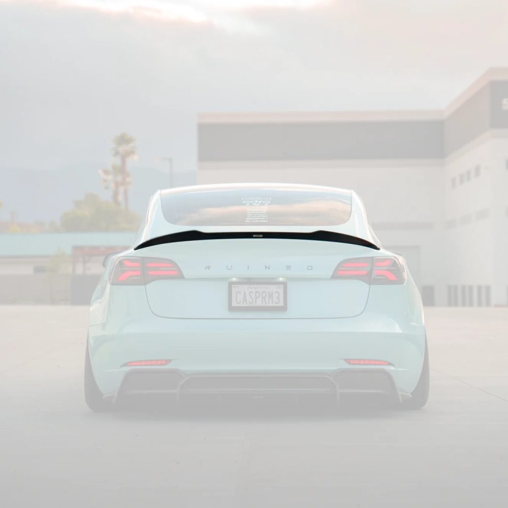ADRO Carbon V2 Rear Spoiler for Tesla Model 3 Installed on Light Blue Model 3 - Spoiler Highlighted