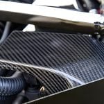 AutoTecknic Dry Carbon ECU Battery Terminal Cover For G87 BMW M2 Installed - Closeup of Carbon Fiber Weave