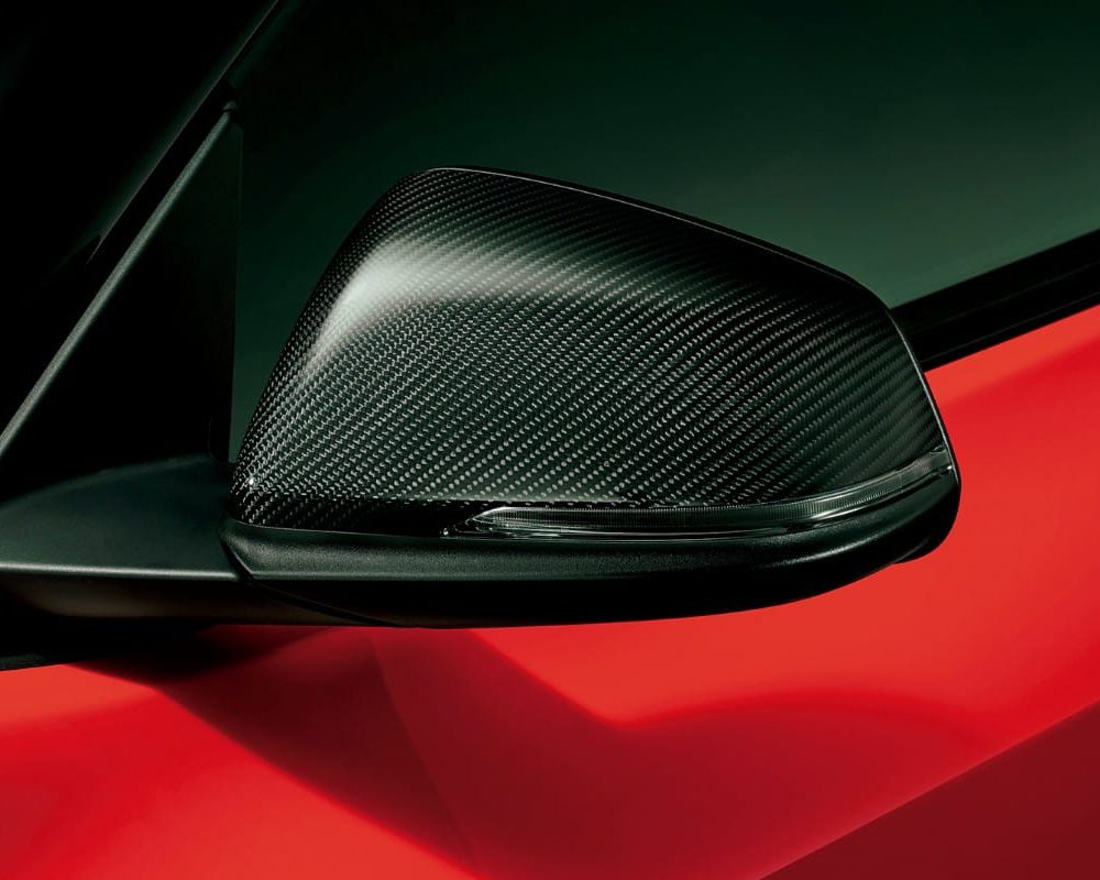 Toyota Gazoo Racing Carbon GR Door Mirror Covers for A90 / A91 Toyota Supra Installed on Red Supra - Close View of Mirror Covers