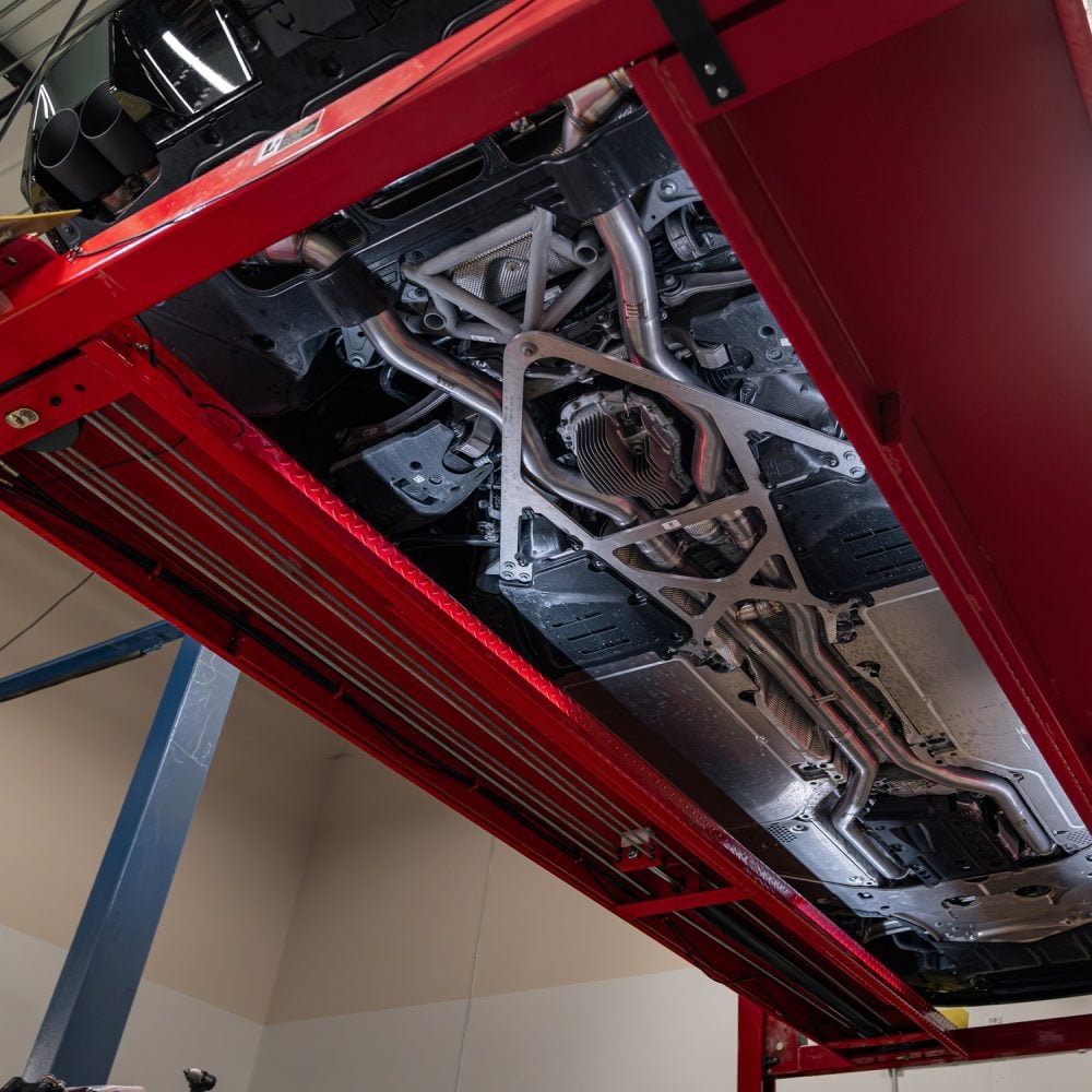 Milltek Valved Axle-Back Exhaust System for G90 / G99 BMW M5 Installed on Car on Lift - Underside View of Car (shows full exhaust system)