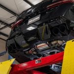 Milltek Valved Axle-Back Exhaust System for G90 / G99 BMW M5 Installed on Car on Lift - Close Rear Underside View of Axle-Back