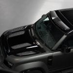 Urban Automotive OCTA Forged Carbon Vented Hood for L663 Land Rover Defender OCTA (pre-facelift) Installed on Black Defender - Upper Frontside View of Vehicle