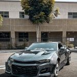 Auto Addict Carbon Wide Body Fender Kit w/ Front Bumper Canards for 6th Gen Chevrolet Camaro LT, RS, SS, and ZL1 Installed on Grey Camaro - Front Side View of Car