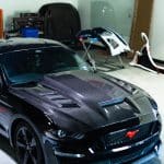 Auto Addict Carbon Terminator Aggressive Style Hood for S550 Ford Mustang EcoBoost, GT, Mach 1, and Shelby Models (facelift) Installed on Black S550 Mustang - Left Front View of Car