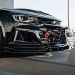Auto Addict Carbon Extension Splitter w/ Rods for 6th Gen Chevrolet Camaro ZL1 and ZL1 1LE Installed on Black ZL1 - Close Front Side View of Bumper