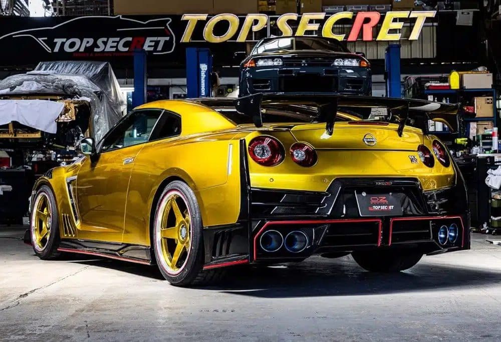 Top Secret GT-R Rear Bumper Set, Installed on Gold GT-R - Rear Side View of Car