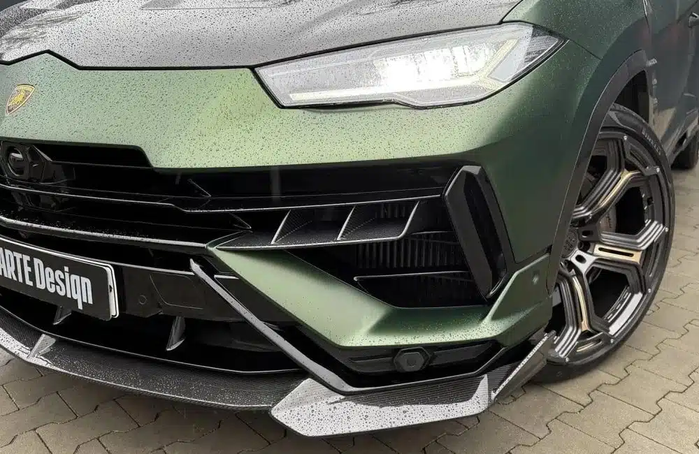 LARTE Design Urus S Front Inserts in Carbon Fiber, Installed on Matte Green Urus S - Close Front Side View of Front Bumper